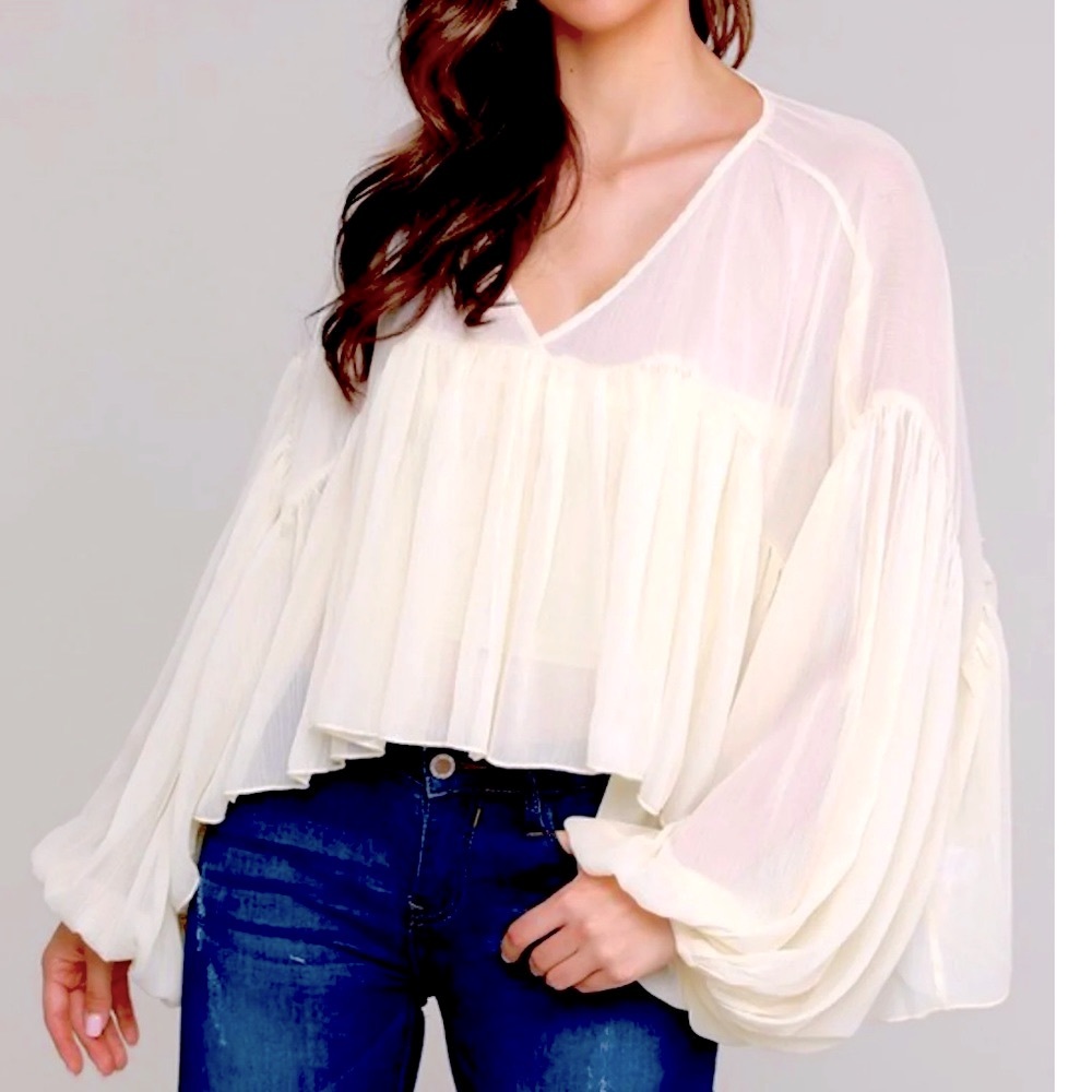 A. Peach boho sheer top.